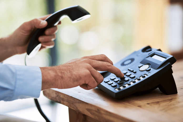dial-those-digits-cropped-shot-of-a-man-dialing-a-2023-11-27-05-19-15-utc